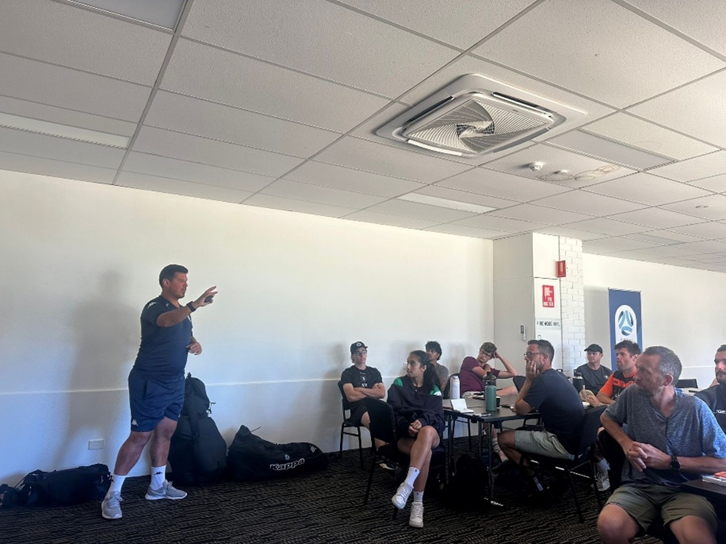 a group of people standing in a room