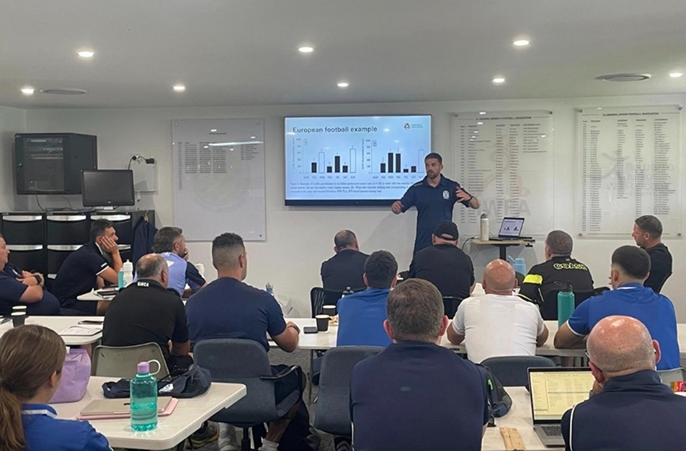 a group of people sitting at a table in a room