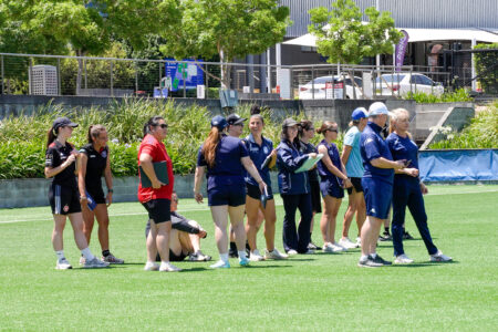a group of people playing a game of frisbee