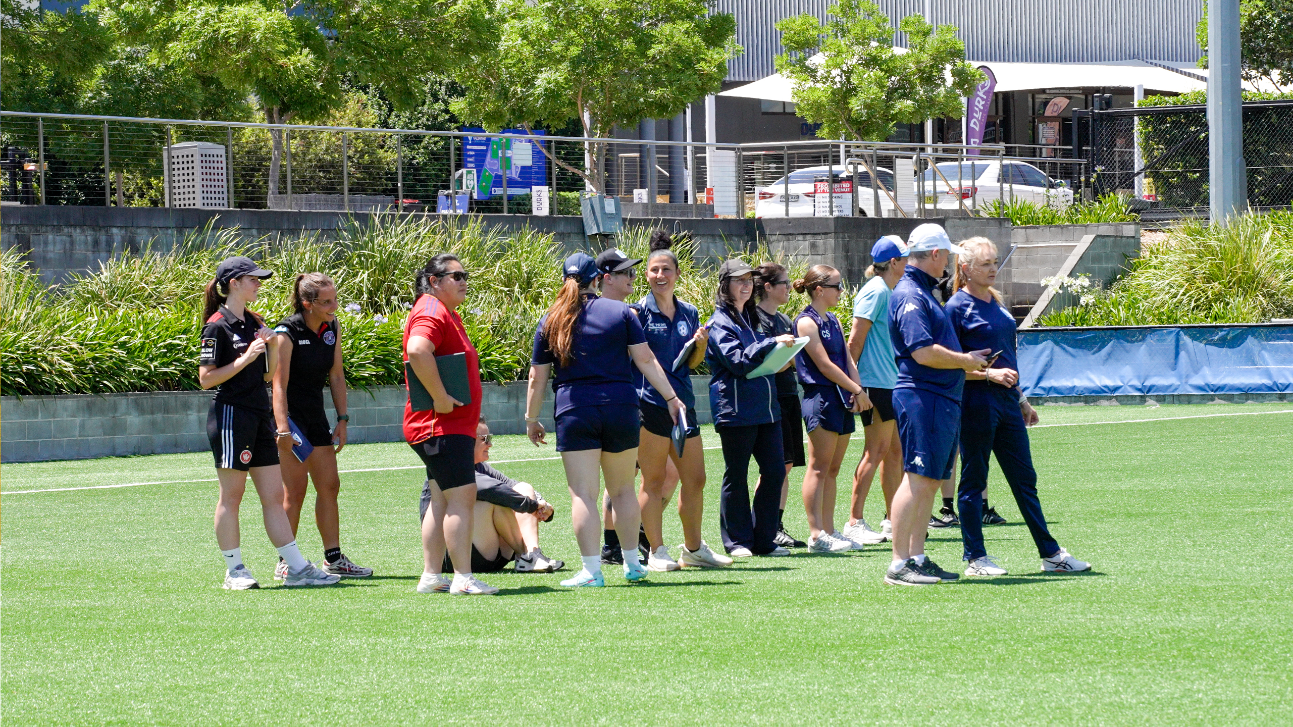 a group of people playing a game of frisbee