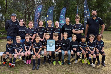 a group of people posing for a photo