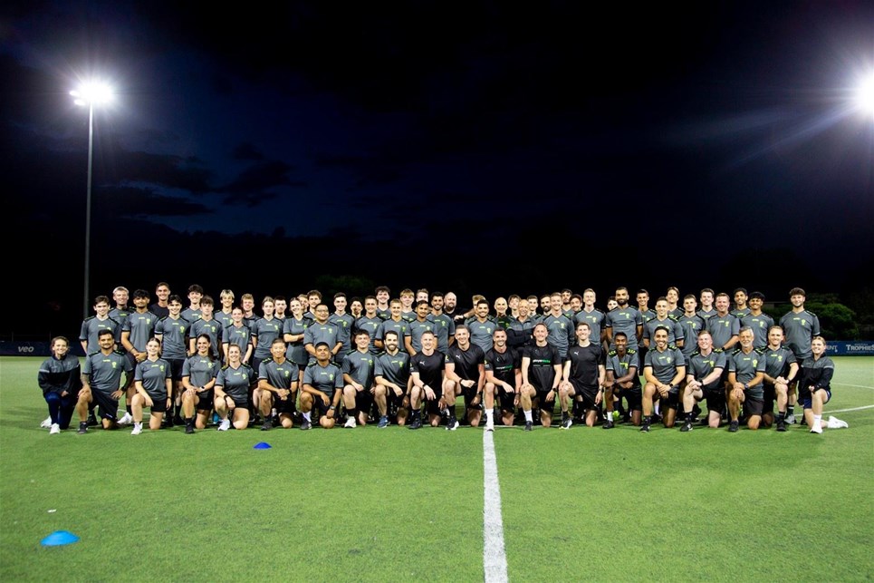 a group of people standing in front of a crowd