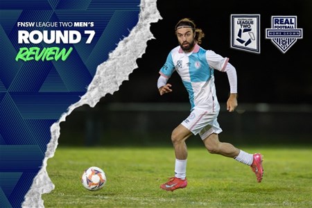 a man holding a football ball