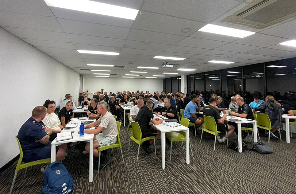 a group of people sitting at a table in a room