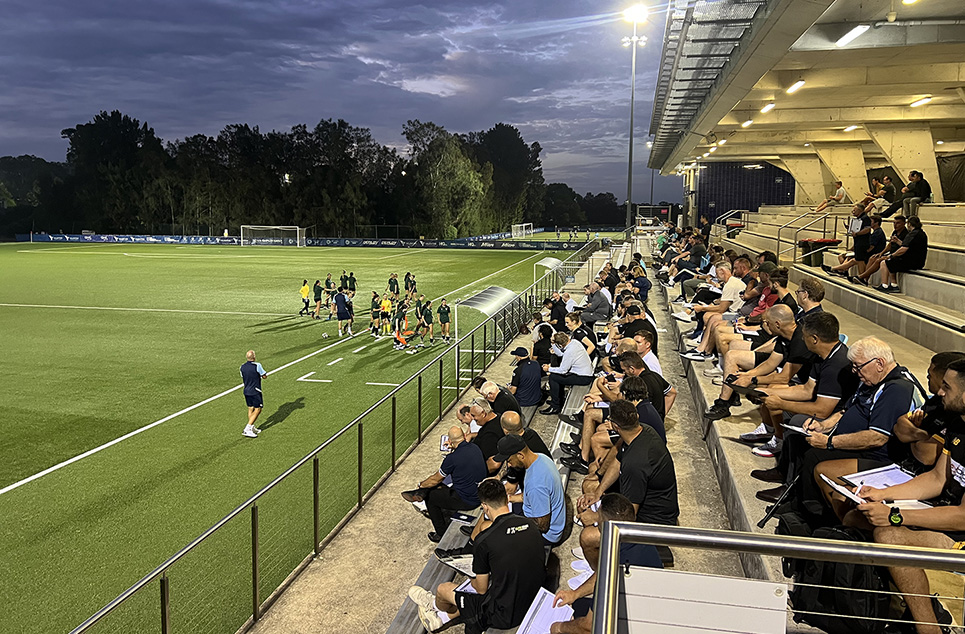 a group of people around a track