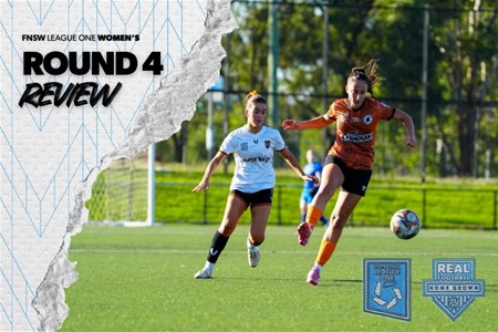 a woman holding a football ball on a field