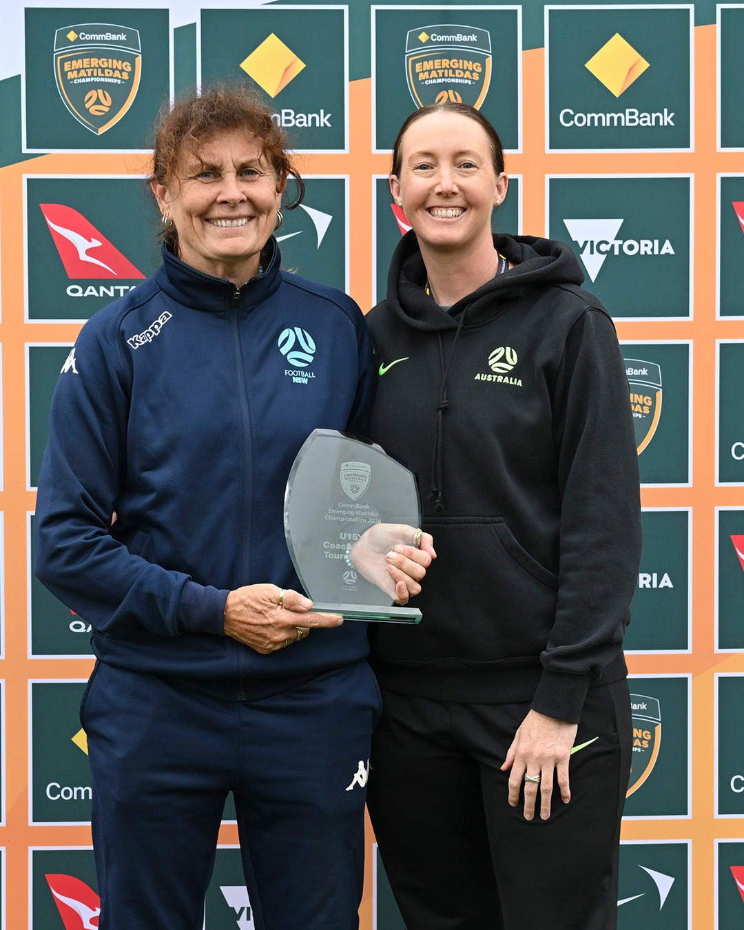 a person holding a sign posing for the camera