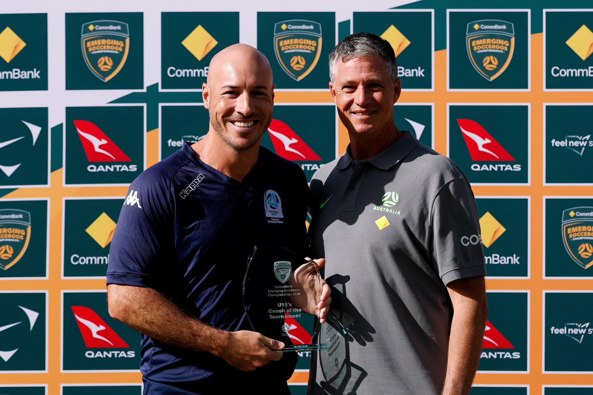 a man holding a sign posing for the camera