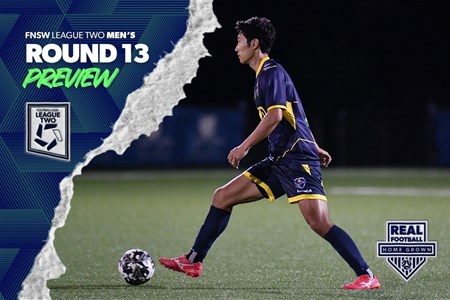 a man holding a football ball