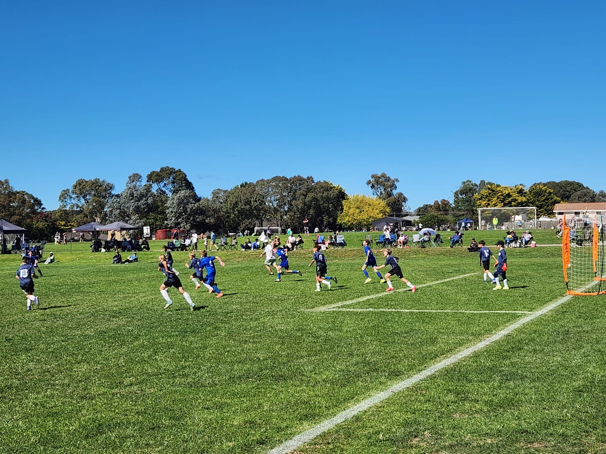 a group of people playing football on a field