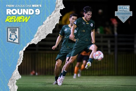 a man holding a football ball