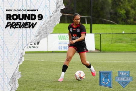 a girl holding a football ball on a field