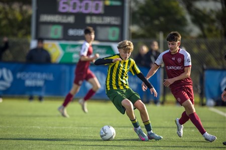 a group of young men playing a game of football