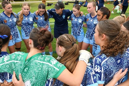 a group of people standing in front of a crowd