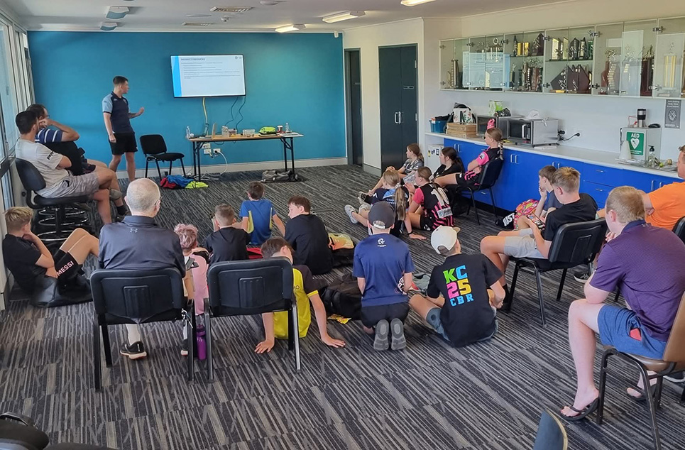 a group of people sitting at a table in a room