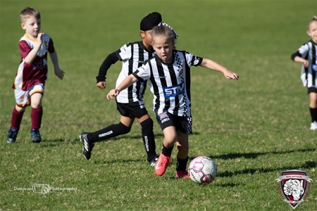 a group of young men playing a game of football