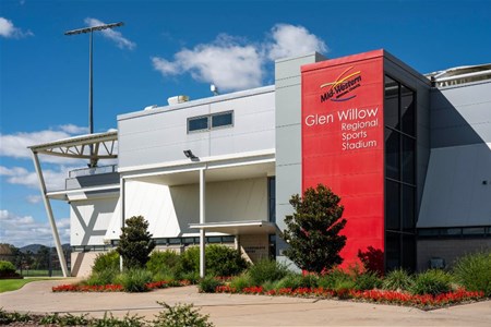 a sign in front of a building