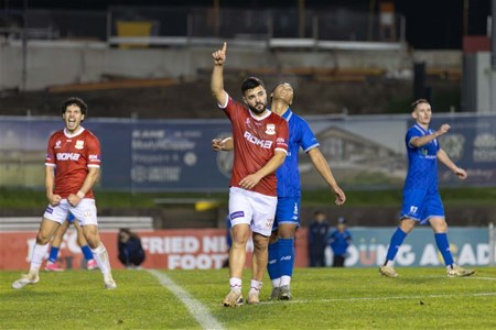 a group of young men playing a game of football