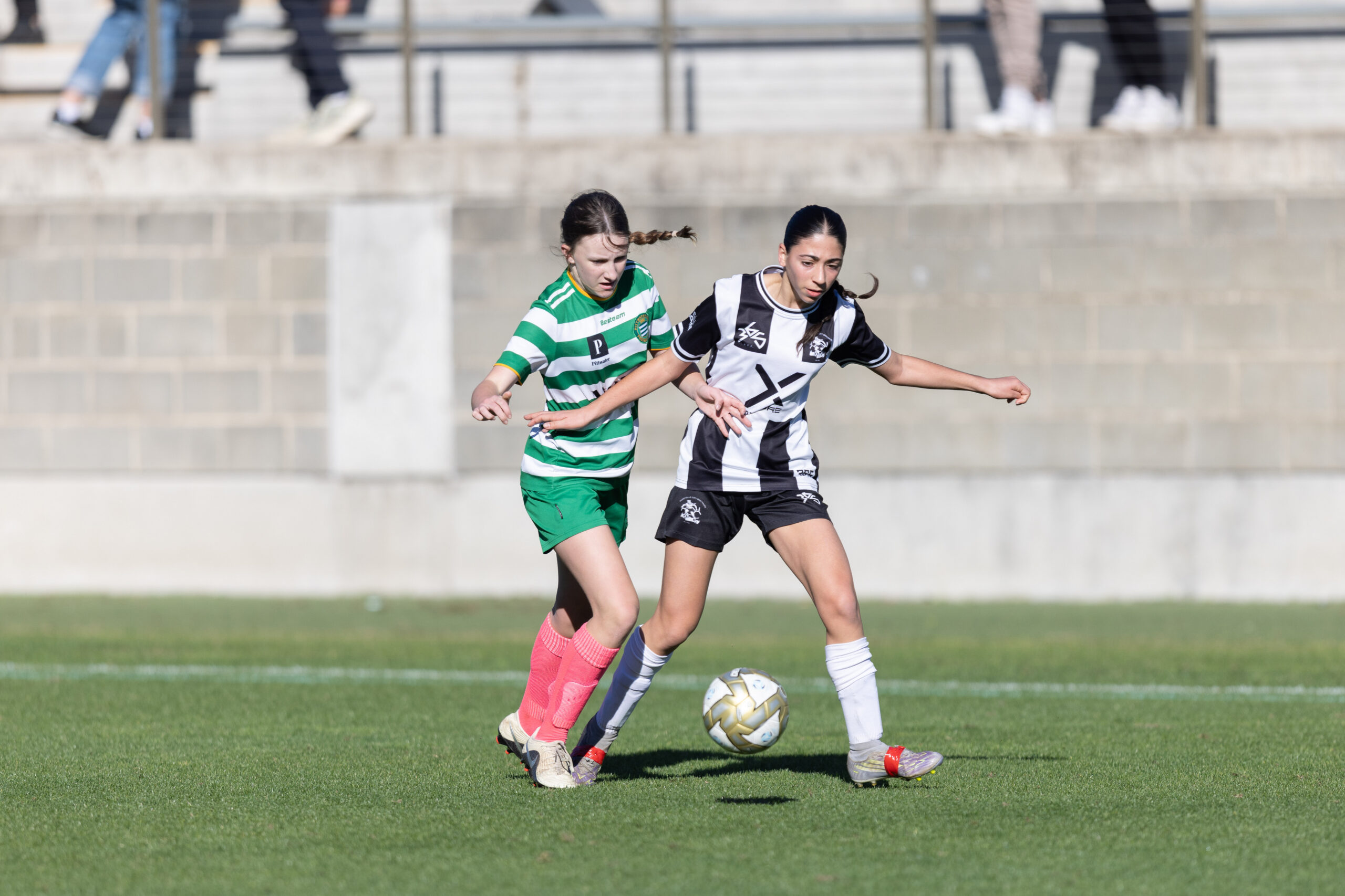 a girl playing football on a field