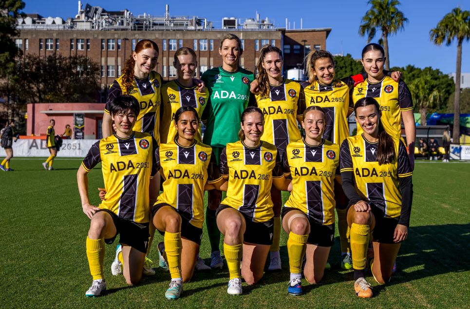 a group of football players posing for a picture