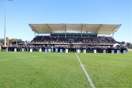a stadium with people in the field