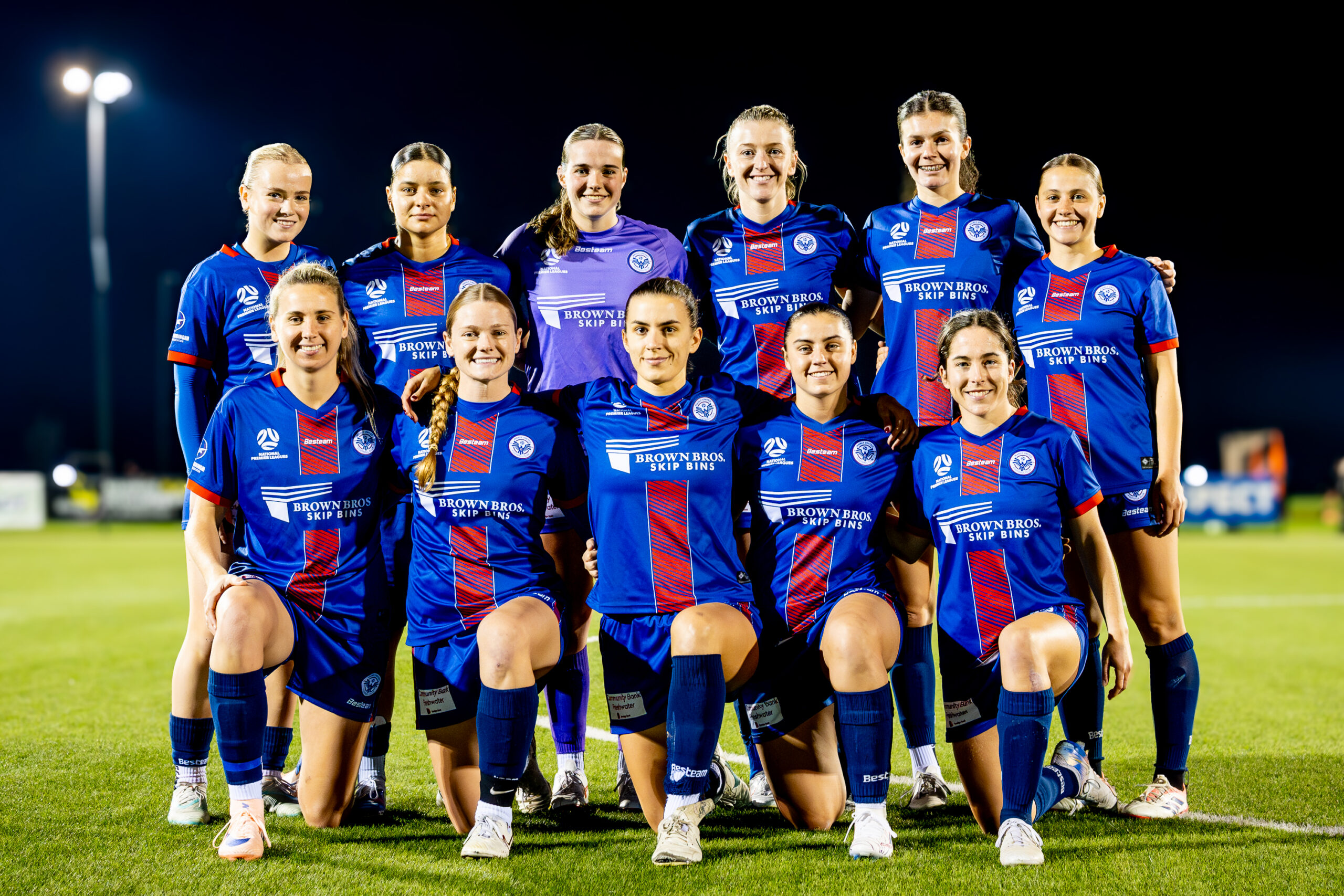 a group of football players posing for a picture