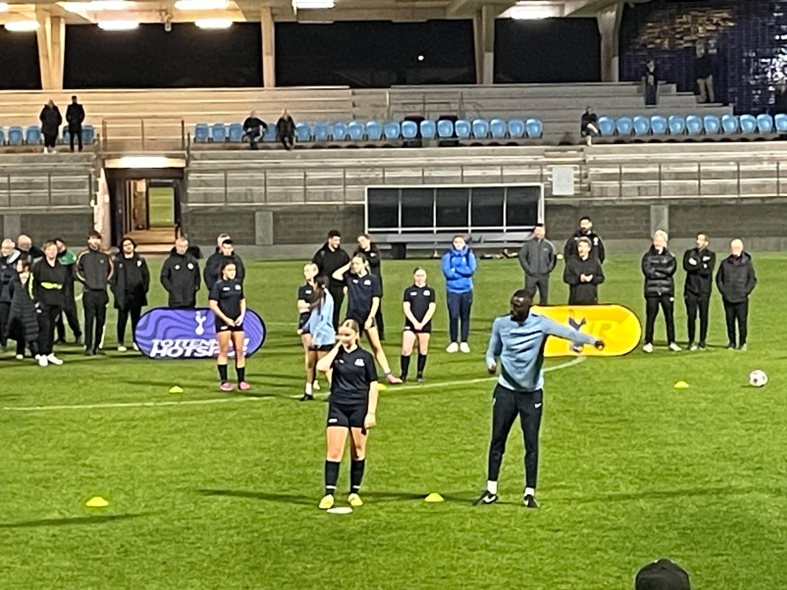 a group of people playing football on a field