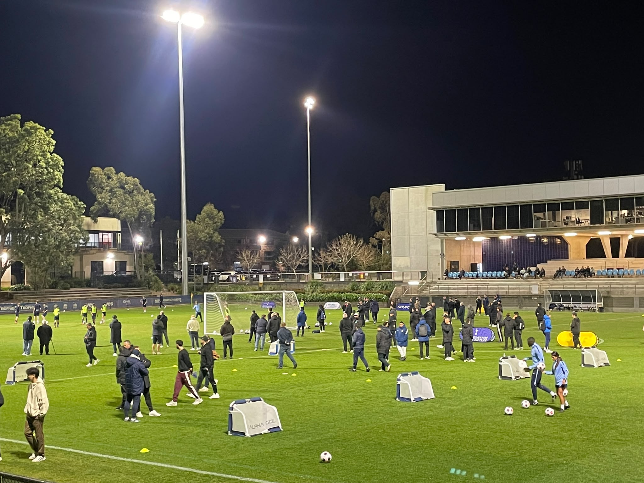 a group of people playing football on a field