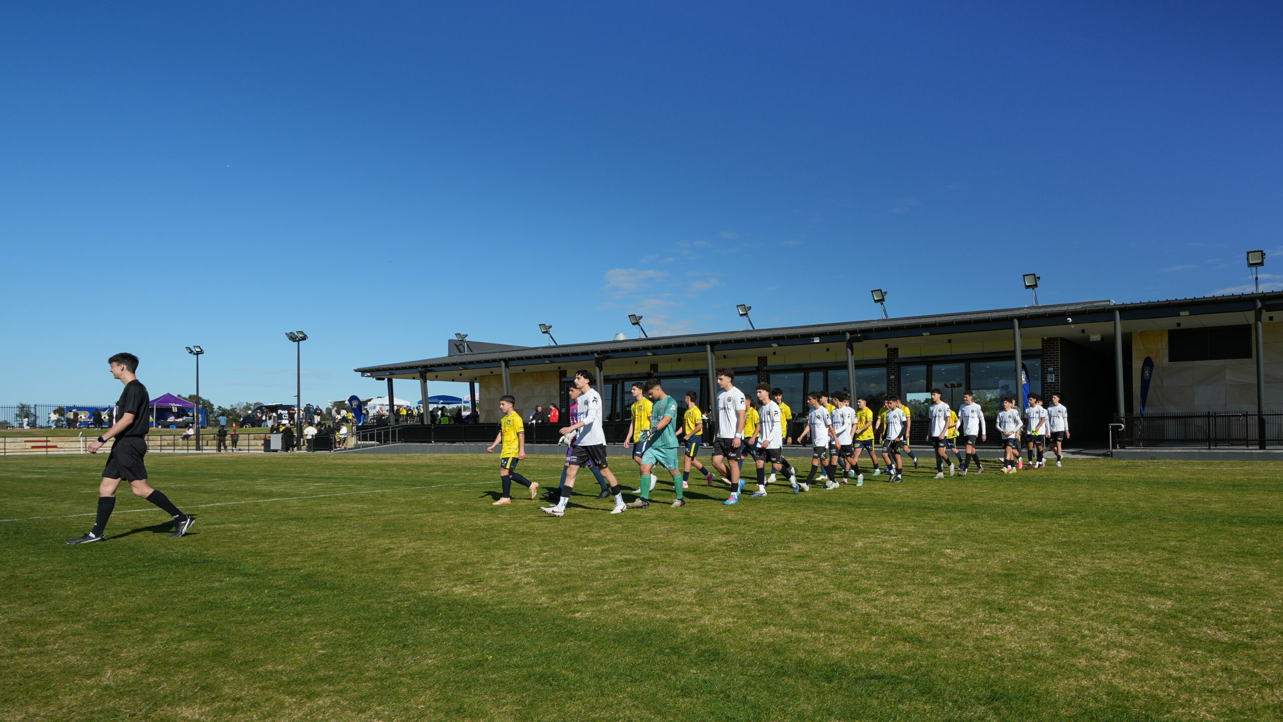 a group of people playing football on a field