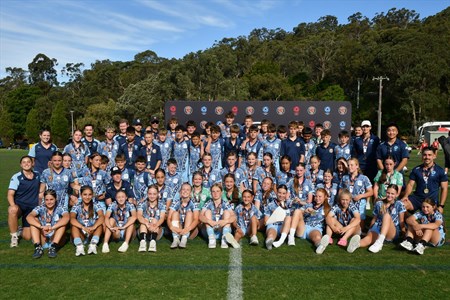 a group of football players posing for a picture