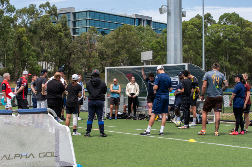 a group of people playing a game of football