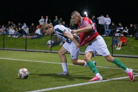 a group of people playing football on a field