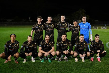 a group of football players posing for a picture