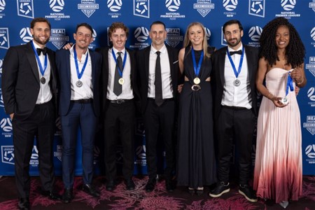 a group of people posing for a photo
