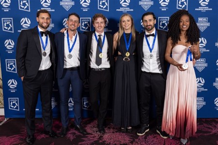 a group of people posing for a photo