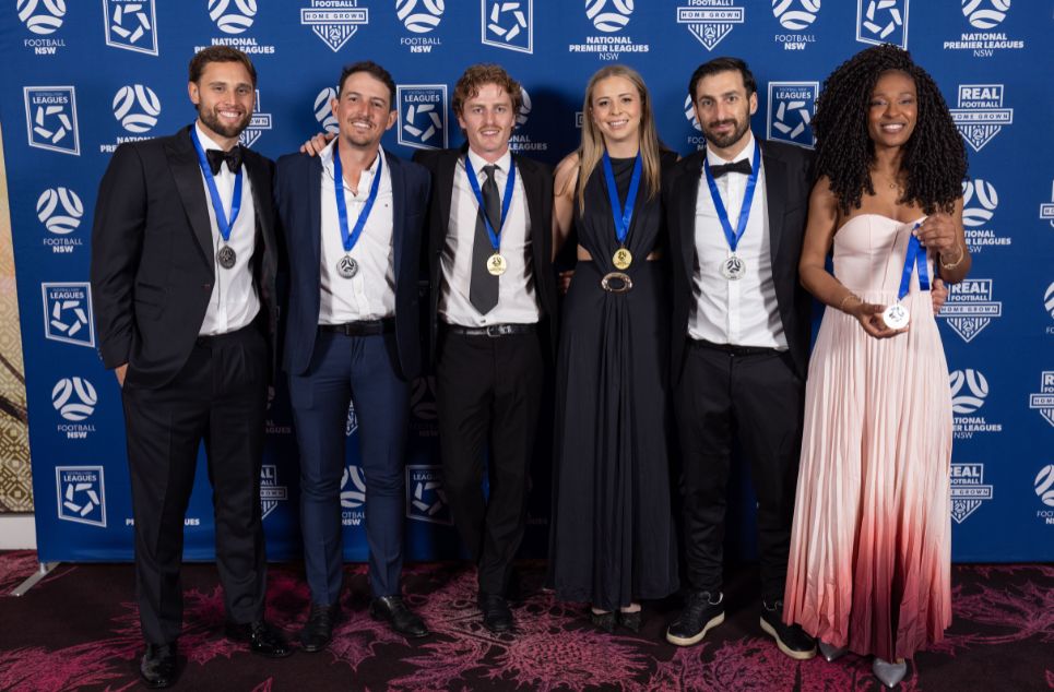 a group of people posing for a photo