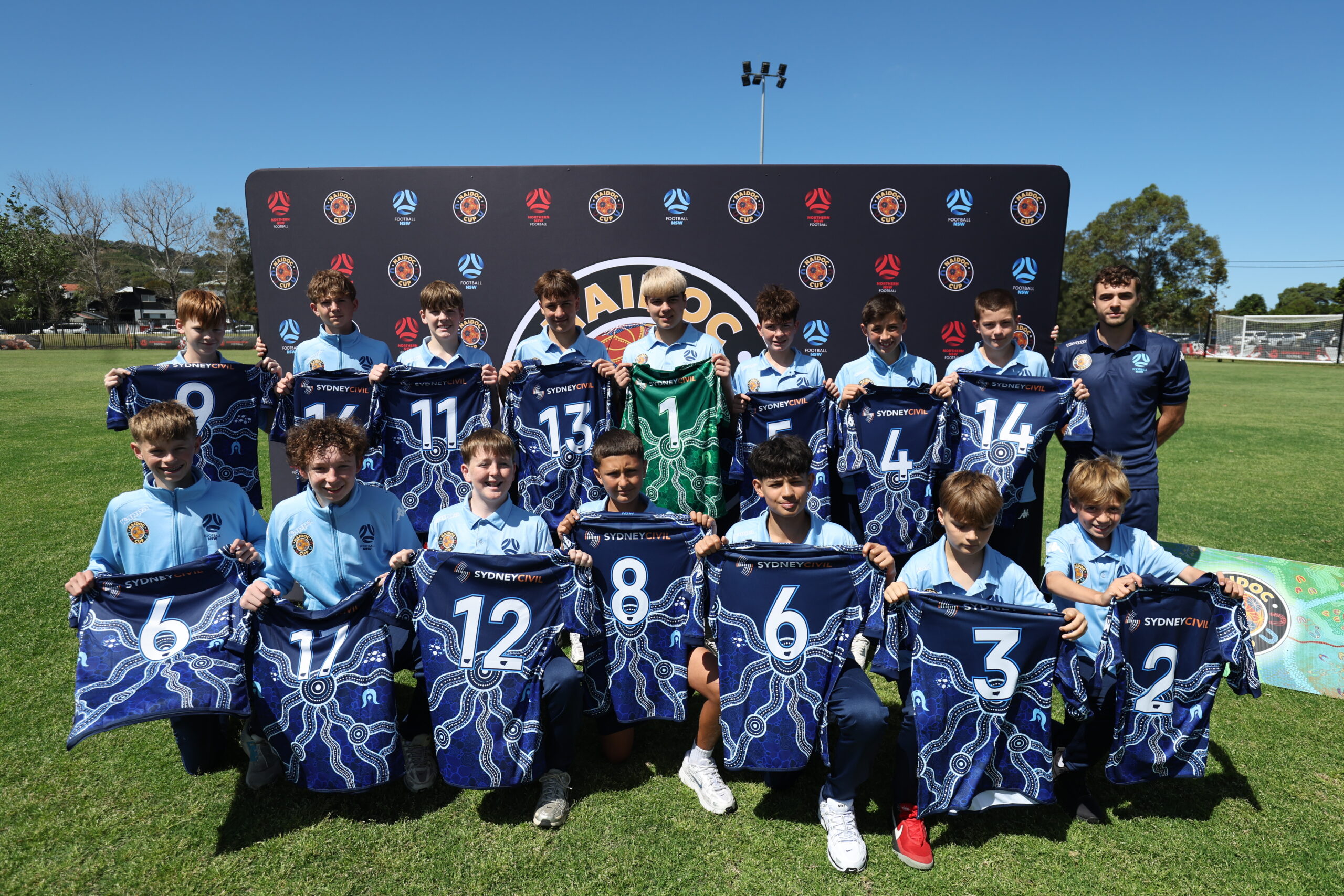 a group of football players posing for a picture