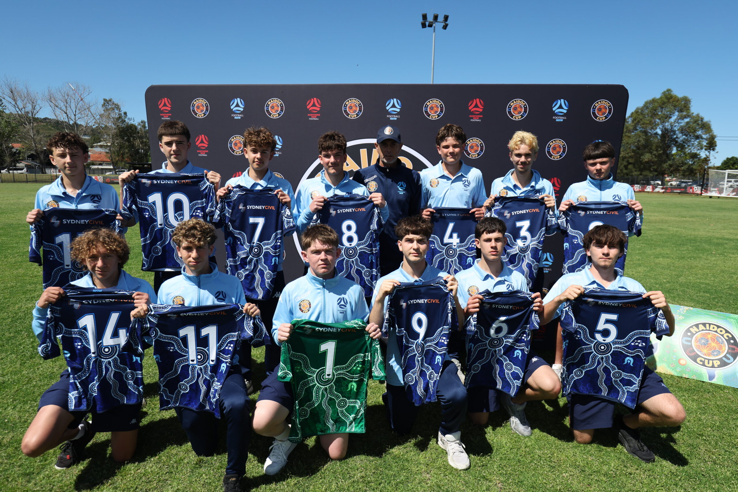 a group of football players posing for a picture