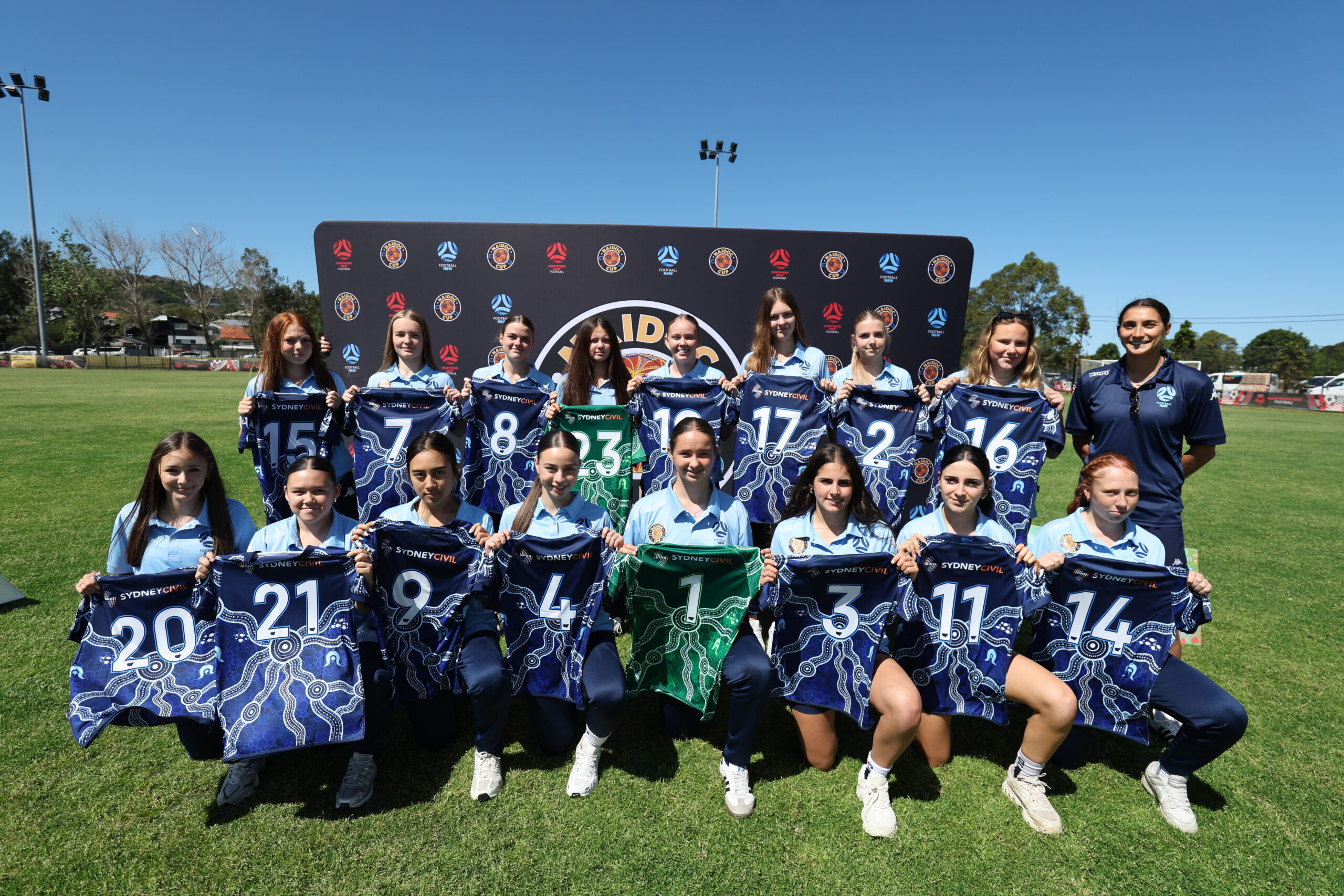 a group of football players posing for a picture