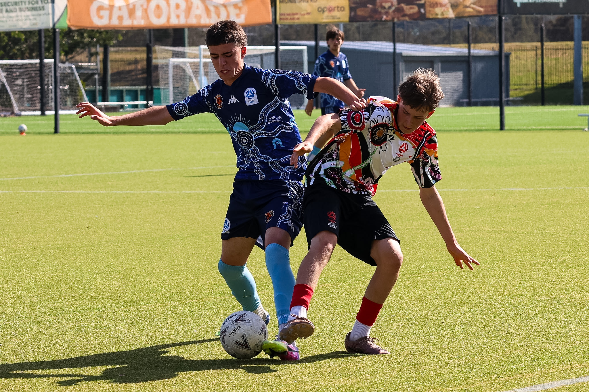 a group of young men playing a game of football