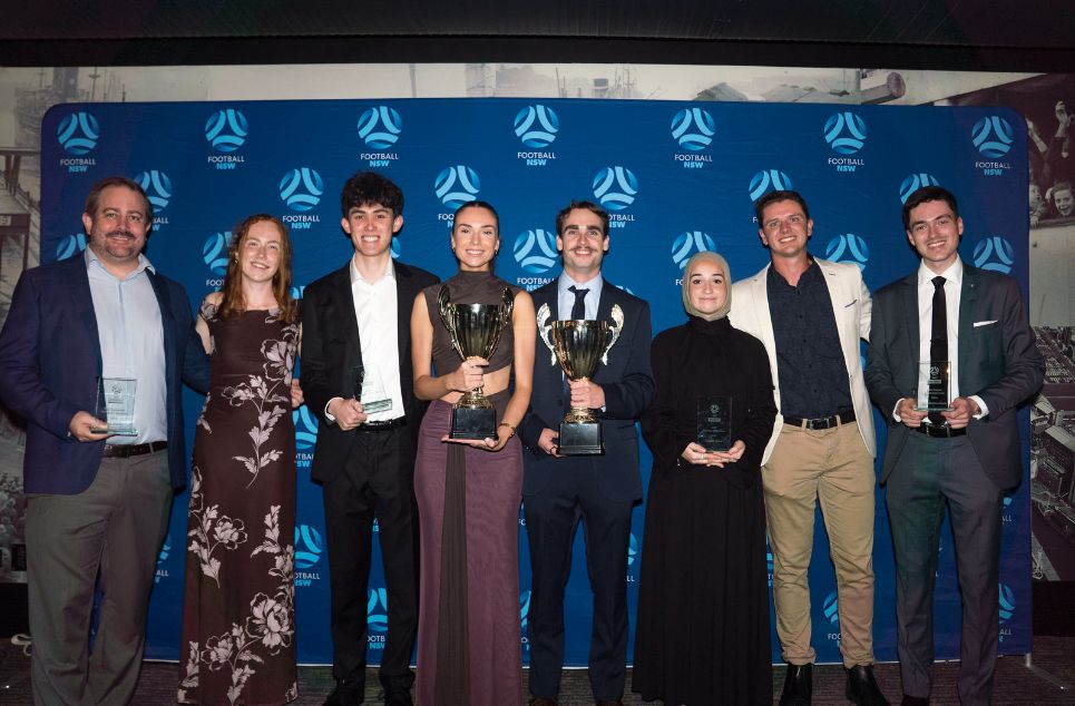 a group of people posing for a photo
