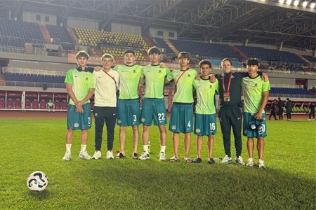 a group of football players posing for a picture