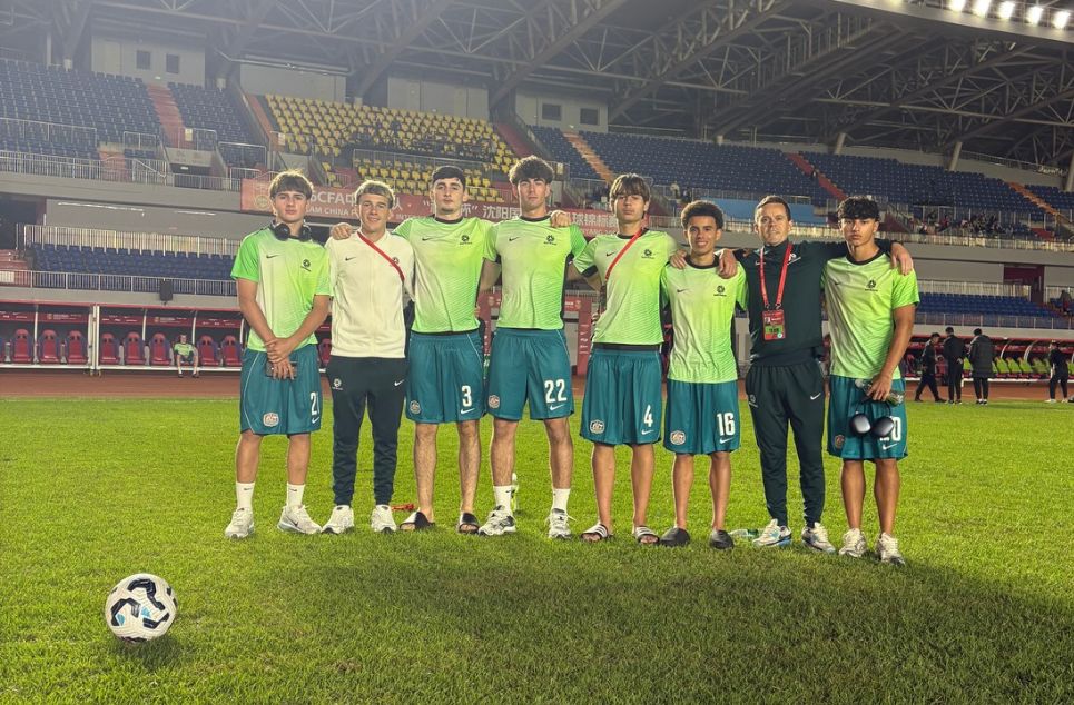 a group of football players posing for a picture